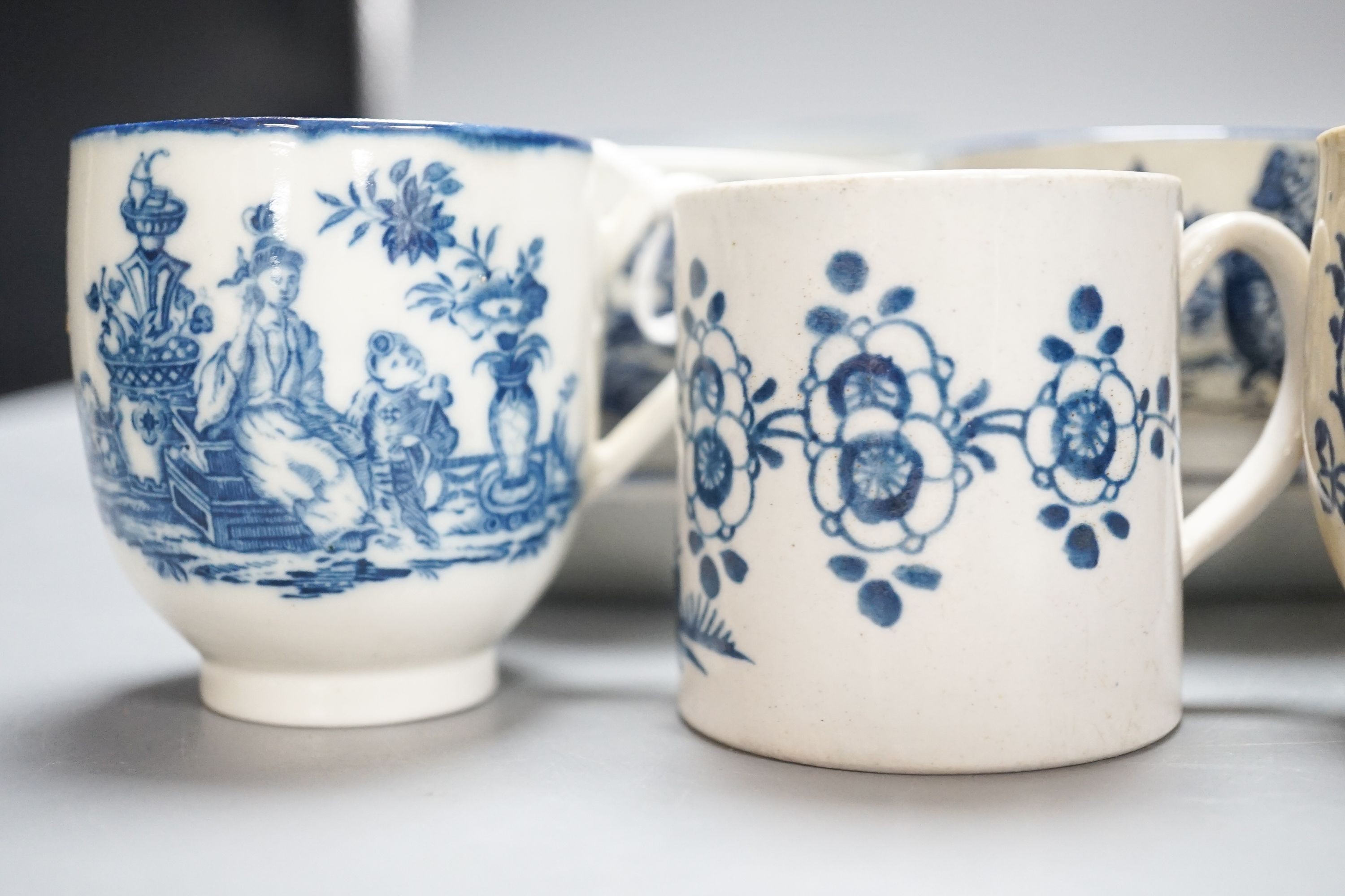 A group of Worcester and Caughley blue and white tea and coffee wares, late 18th century including fisherman pattern, three flowers pattern, chinoiserie figures etc.